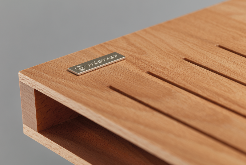 7-Slot In-Drawer Knife Tray crafted from smooth natural wood with evenly spaced slots and a metal WÜSTHOF logo plate on the corner.