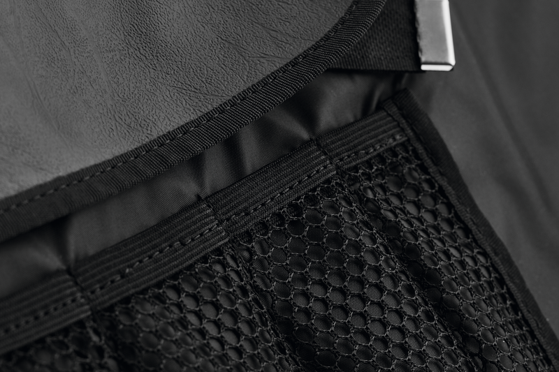 Close-up of the black Nylon Knife Roll interior showing durable mesh pockets and reinforced stitching designed for securely holding forged kitchen knives.