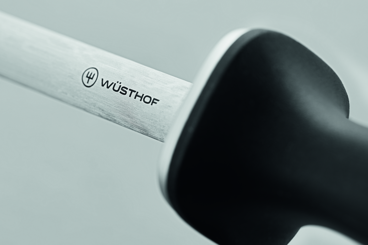 12" Honing Steel featuring a polished stainless steel rod with the WÜSTHOF logo and an ergonomic black handle for precise knife maintenance.