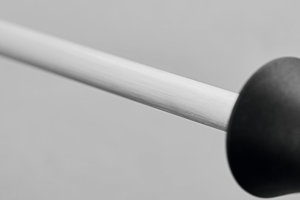 9" Honing Steel with a finely textured metal rod and a smooth black ergonomic handle designed for sharpening WÜSTHOF forged kitchen knives.