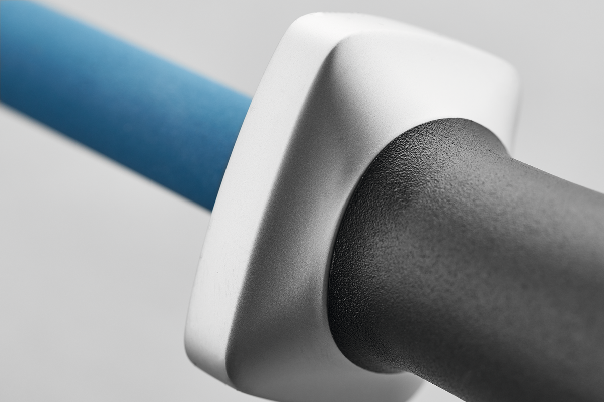 Close-up of the ergonomic black handle and silver guard on the 10" Ceramic Sharpening Rod J800 with a blue ceramic sharpening surface.