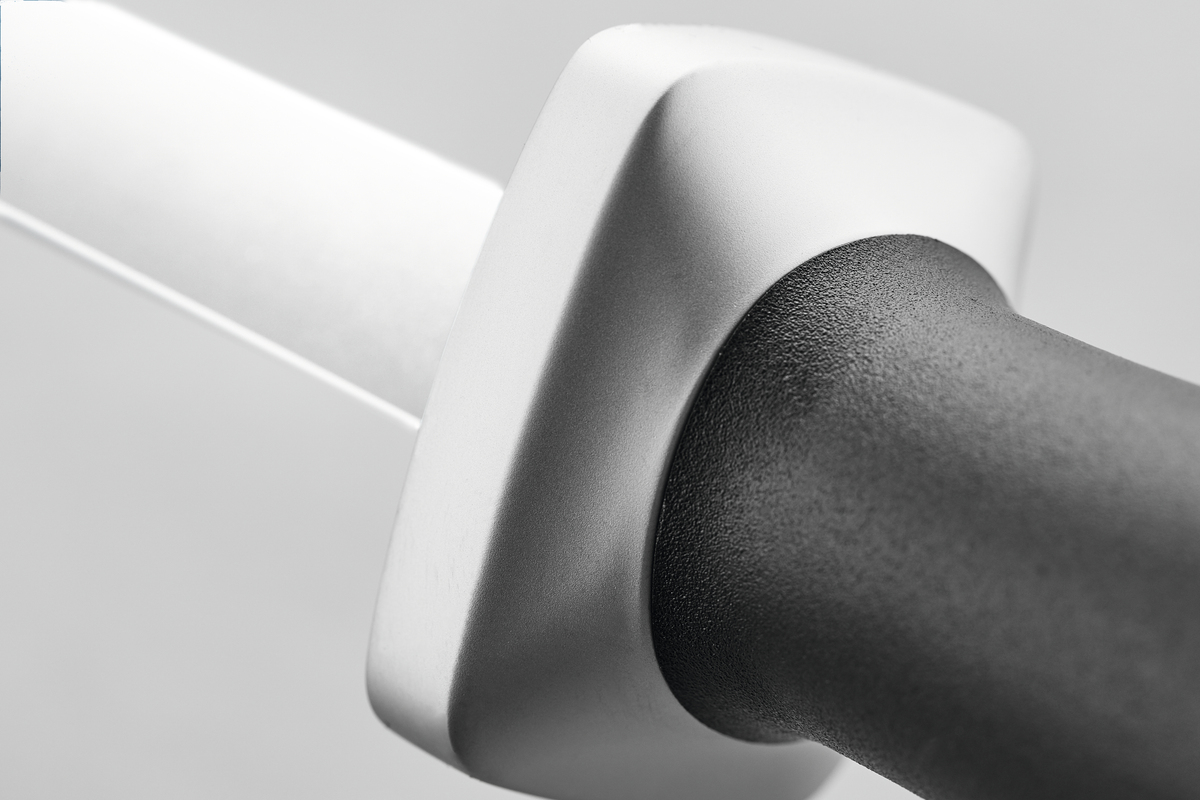 Close-up of the black ergonomic handle and white ceramic rod on the Ceramic Sharpening Rod J3000 designed for precise honing of WÜSTHOF German knives.
