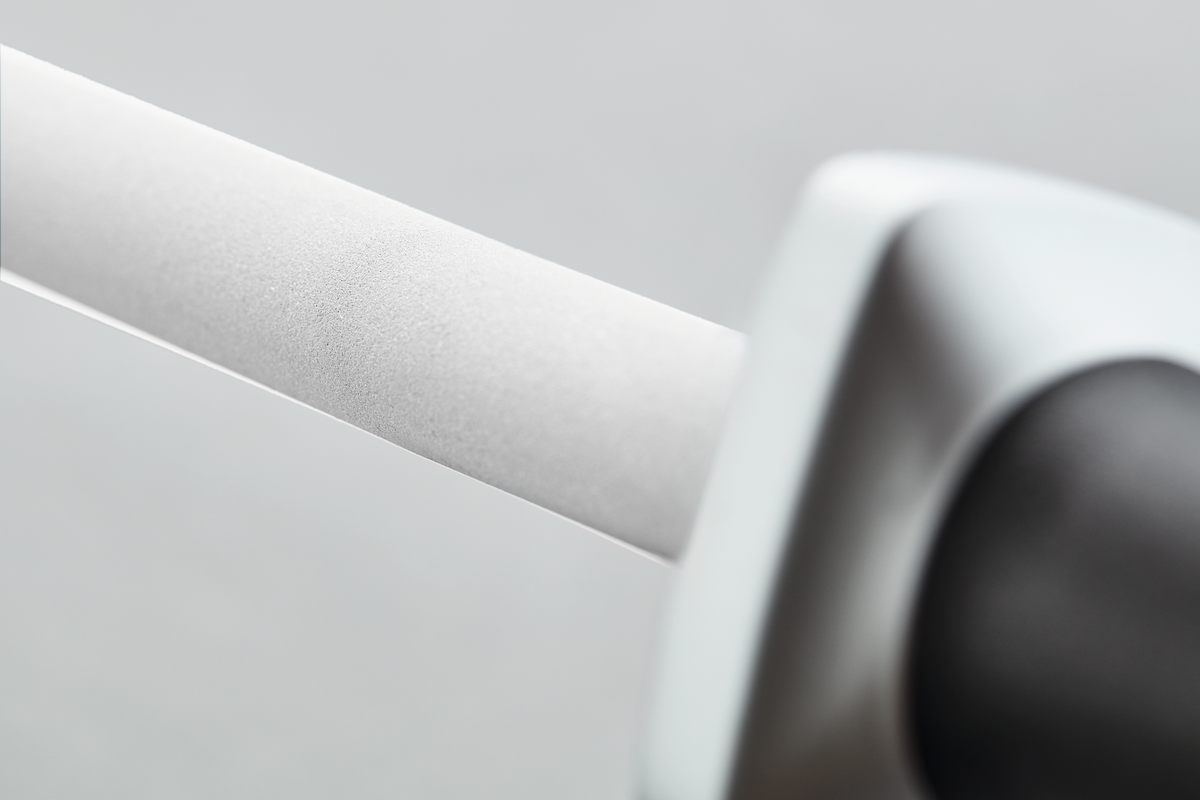 Ceramic Sharpening Rod J3000 featuring a smooth white ceramic rod and ergonomic black handle for honing German knives with precision and control.