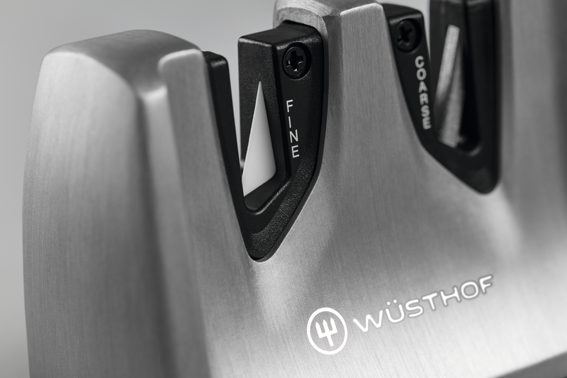 Classic Ikon Hand-Held Knife Sharpener with brushed stainless steel construction featuring fine and coarse sharpening slots designed for WÜSTHOF forged kitchen knives.