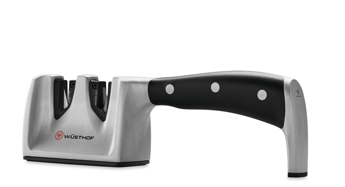 Classic Ikon Hand-Held Knife Sharpener featuring a sturdy stainless steel body with an ergonomic black handle designed for sharpening WÜSTHOF forged kitchen knives.
