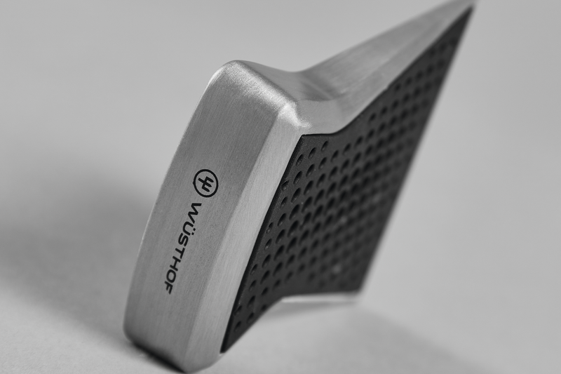 Sharpening Guide 'Slider' with brushed steel edges and a textured rubber surface for accurate angle positioning on WÜSTHOF forged kitchen knives.