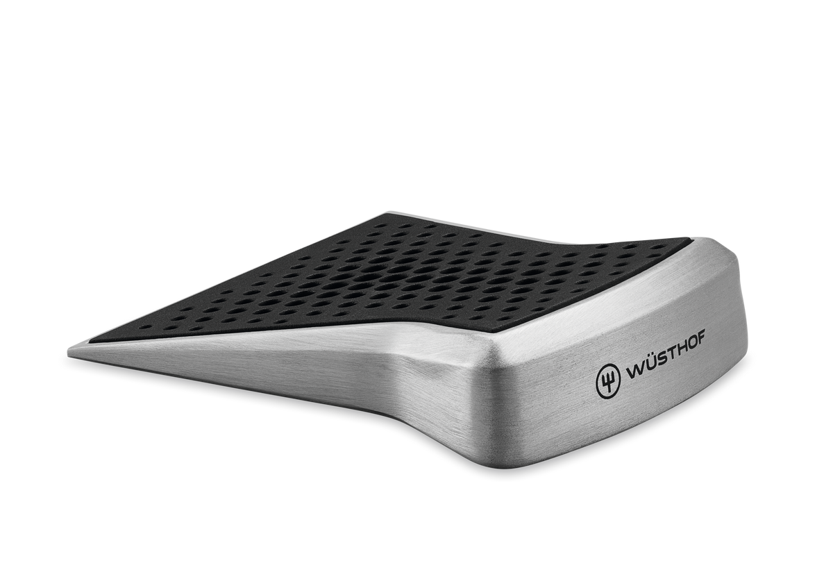 Sharpening Guide 'Slider' with brushed stainless steel body and perforated black rubber surface for precise angle control when sharpening WÜSTHOF knives.