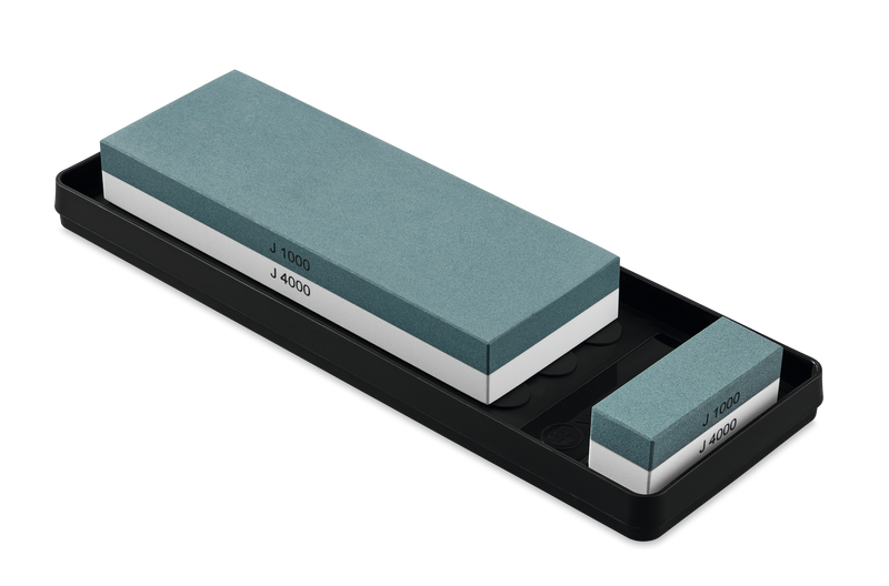Whetstone J 1000 / 4000 incl. non-slip Holder with dual grit sharpening surfaces in teal for maintaining sharp edges on forged kitchen knives.