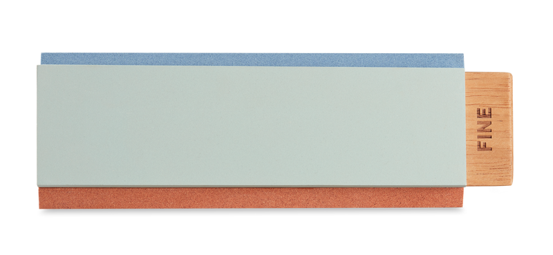 Tri-Stone Knife Sharpener featuring a wooden base with a detachable dual-sided sharpening stone for refining the edge of forged kitchen knives.