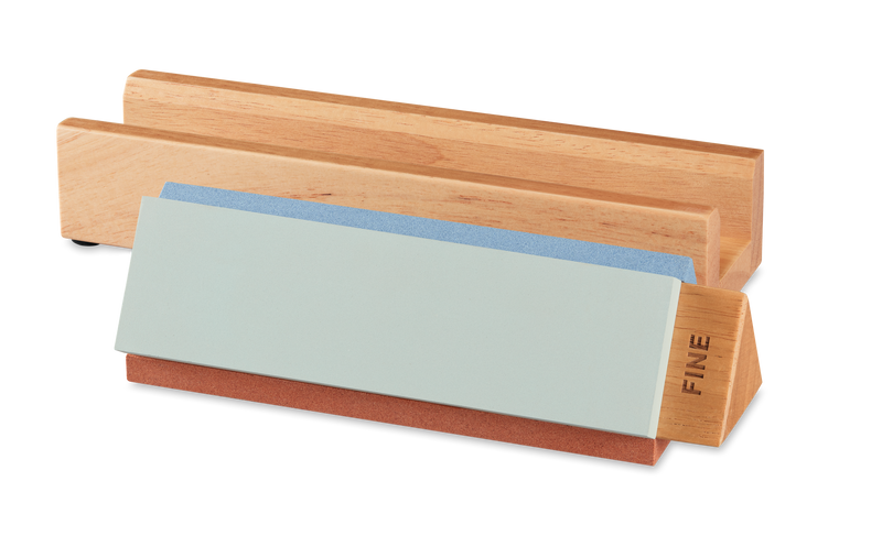 Tri-Stone Knife Sharpener with a wooden base and detachable sharpening stones including a fine grit stone for maintaining sharp edges on German forged kitchen knives.