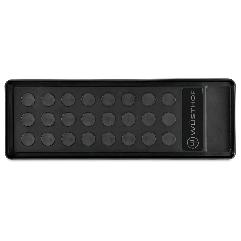 Whetstone Non-slip Holder in black with raised circular grips and WÜSTHOF logo, designed to securely stabilize sharpening stones during use.