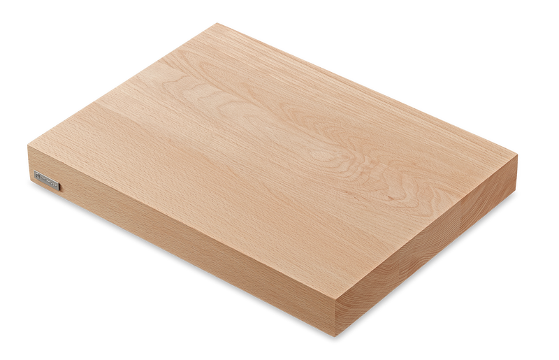 Beech Cutting Board made from thick, light-colored wood with a smooth surface and subtle natural grain, featuring a small metal logo plate.