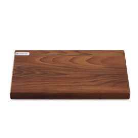 Heat-Treated Beech Cutting Board with a rich wood grain surface and a sleek WÜSTHOF metal logo plate for stylish and durable kitchen use.