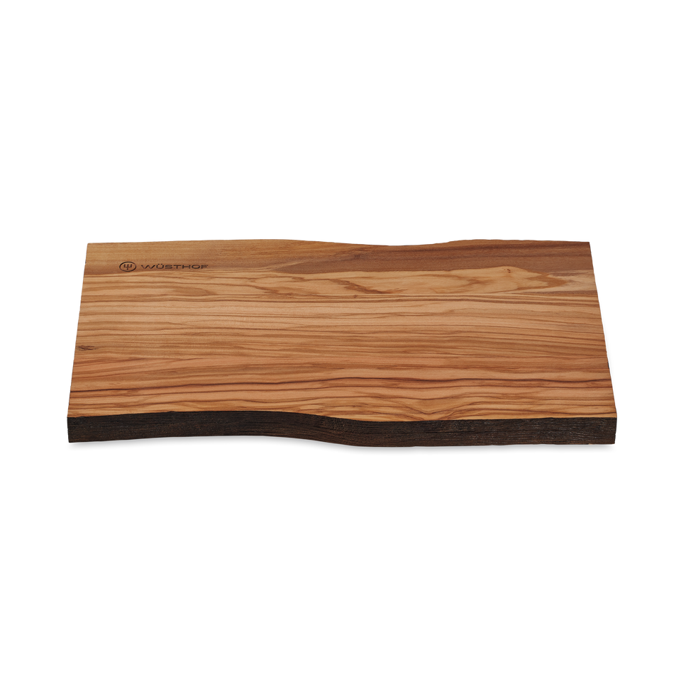 Dune Cutting Board made from natural wood with a smooth, grain-textured surface and organic, uneven edges, branded subtly on one corner.