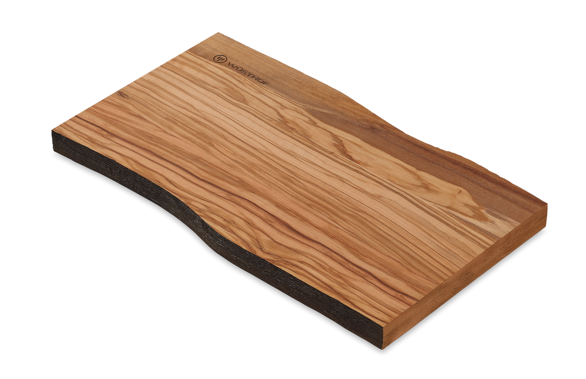 Dune Cutting Board crafted from smooth natural wood featuring a distinctive grain pattern and a live-edge design on one side.