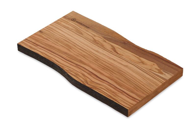 Dune Cutting Board crafted from smooth natural wood featuring a distinctive grain pattern and a live-edge design on one side.