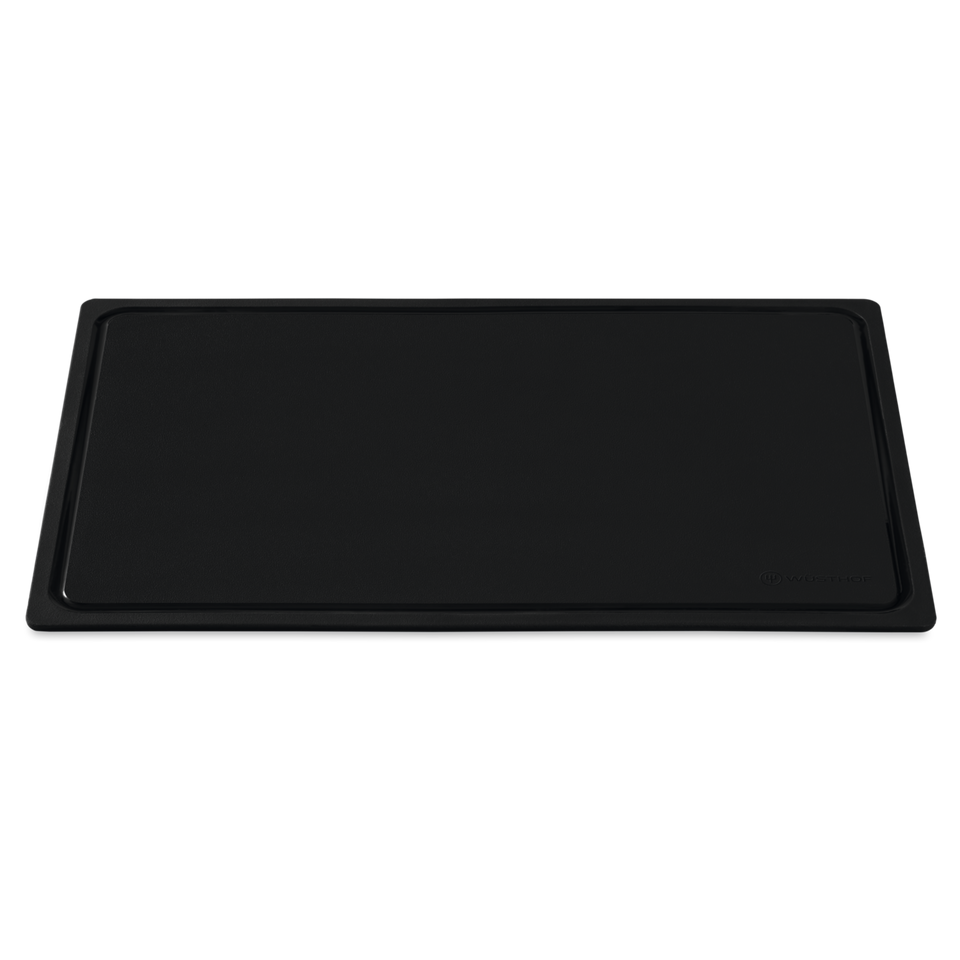 TPU Cutting Board in black with a smooth, durable surface, featuring a raised edge to contain liquids and a subtle logo embossed in the corner.
