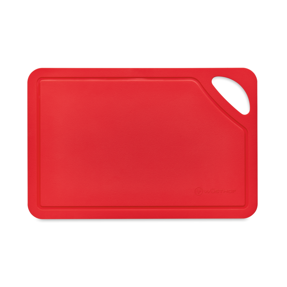 Red TPU Cutting Board featuring a textured cutting surface, integrated handle for easy grip, and a juice groove around the edges.