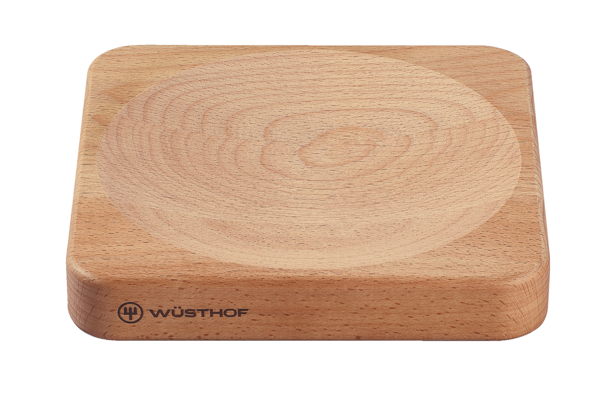 2-Piece Mincing Set featuring a natural wood cutting board with a carved groove and the WÜSTHOF logo on the side for secure knife placement.