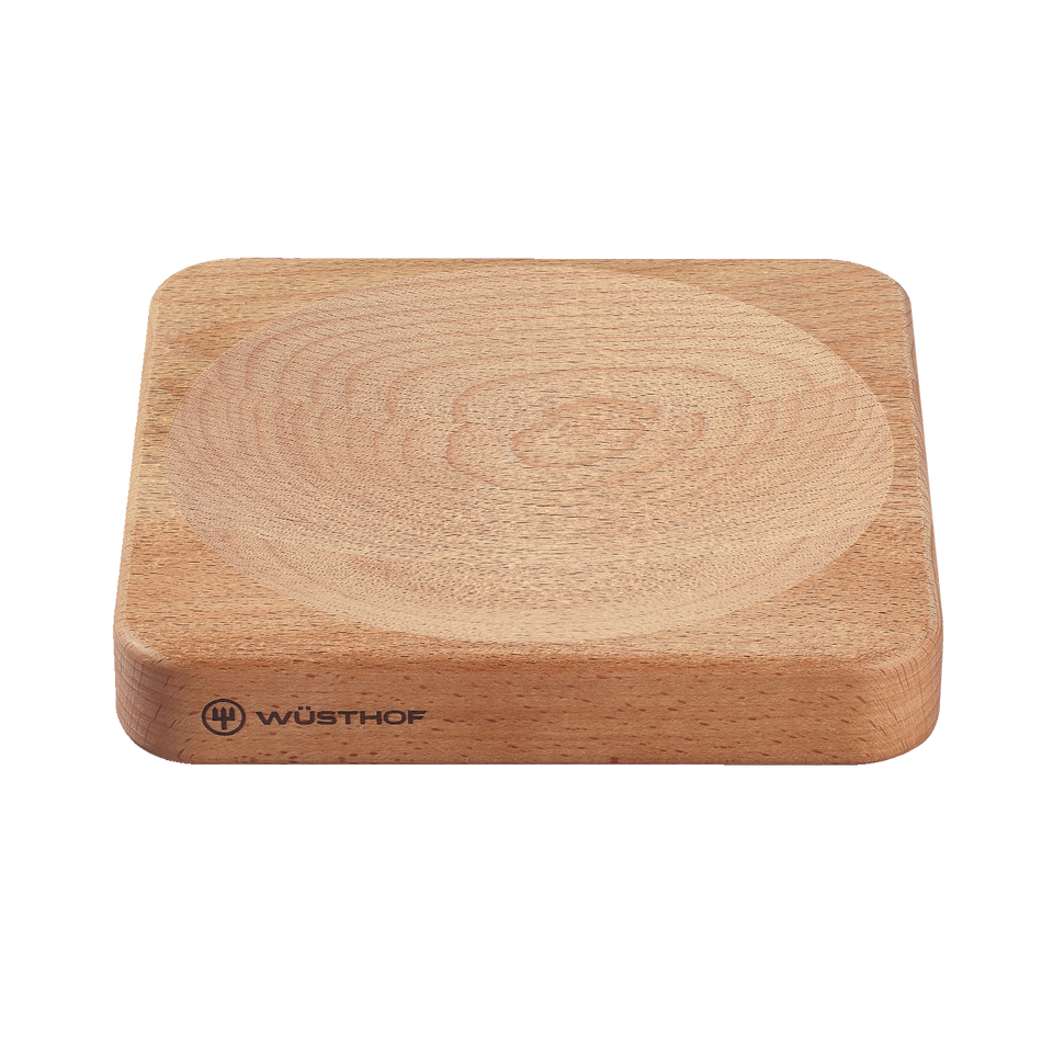 Mincing Board made from smooth, light-colored wood with a shallow central groove and WÜSTHOF logo, ideal for chopping and mincing tasks.