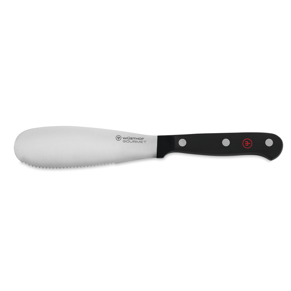 Gourmet 5" Spreader with a stainless steel blade featuring a serrated edge and a triple-riveted black ergonomic handle for comfortable spreading.