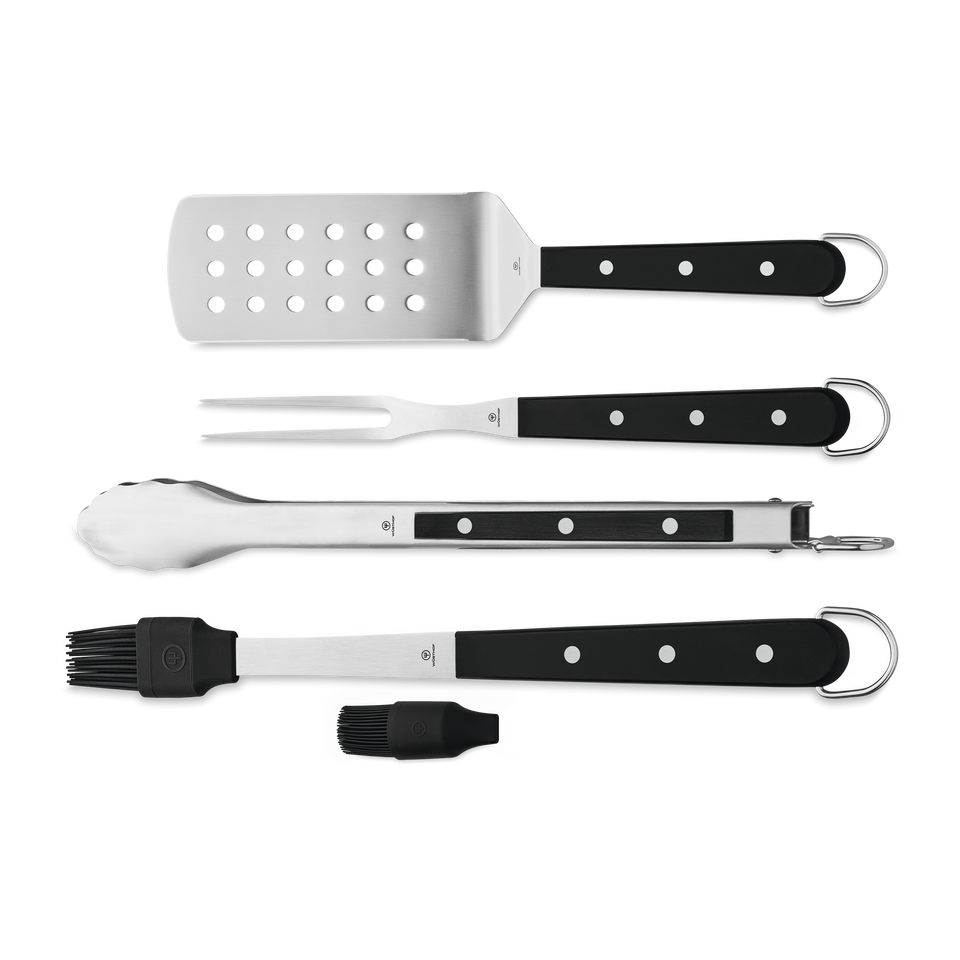 4-Piece BBQ Set featuring a perforated stainless steel spatula, two-pronged fork, locking tongs, and a silicone basting brush with black handles and hanging loops.