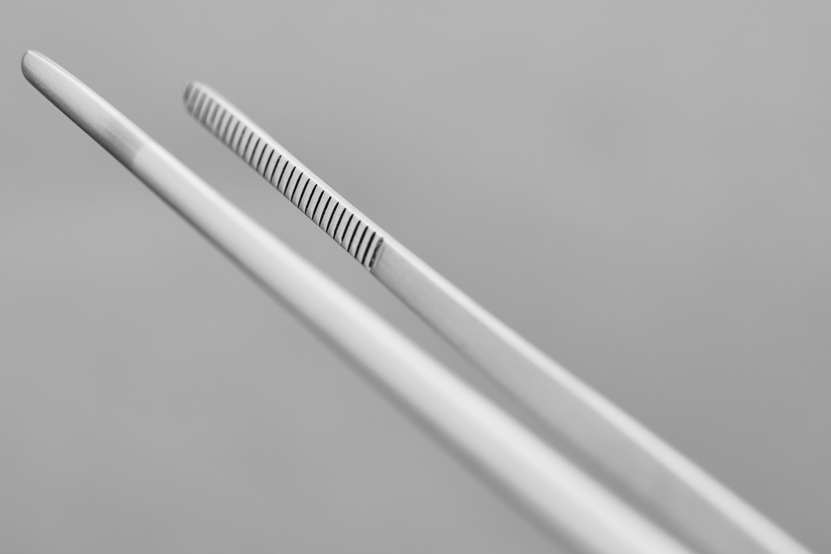 Gourmet Tweezers made of polished stainless steel with fine ridged tips for secure, precise handling in detailed kitchen tasks.
