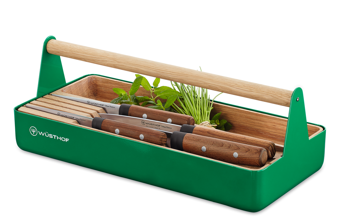 Urban Farmer Tool Basket with a vibrant green metal frame, natural wood handle, and organized space for WÜSTHOF knives and fresh herbs.