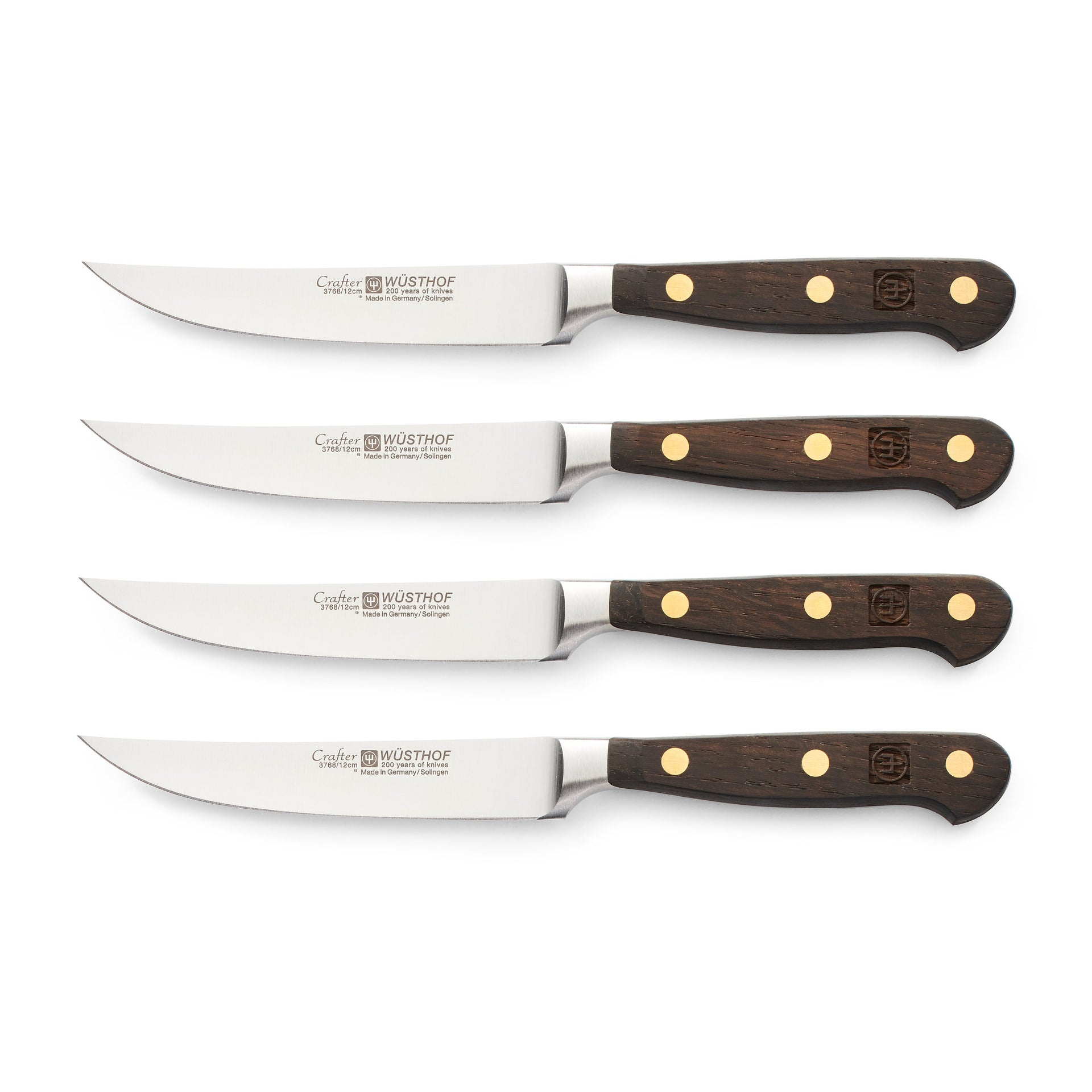Crafter 4-Piece Steak Knife Set featuring finely forged German steel blades and triple-riveted dark wooden handles for precise and durable steak cutting.
