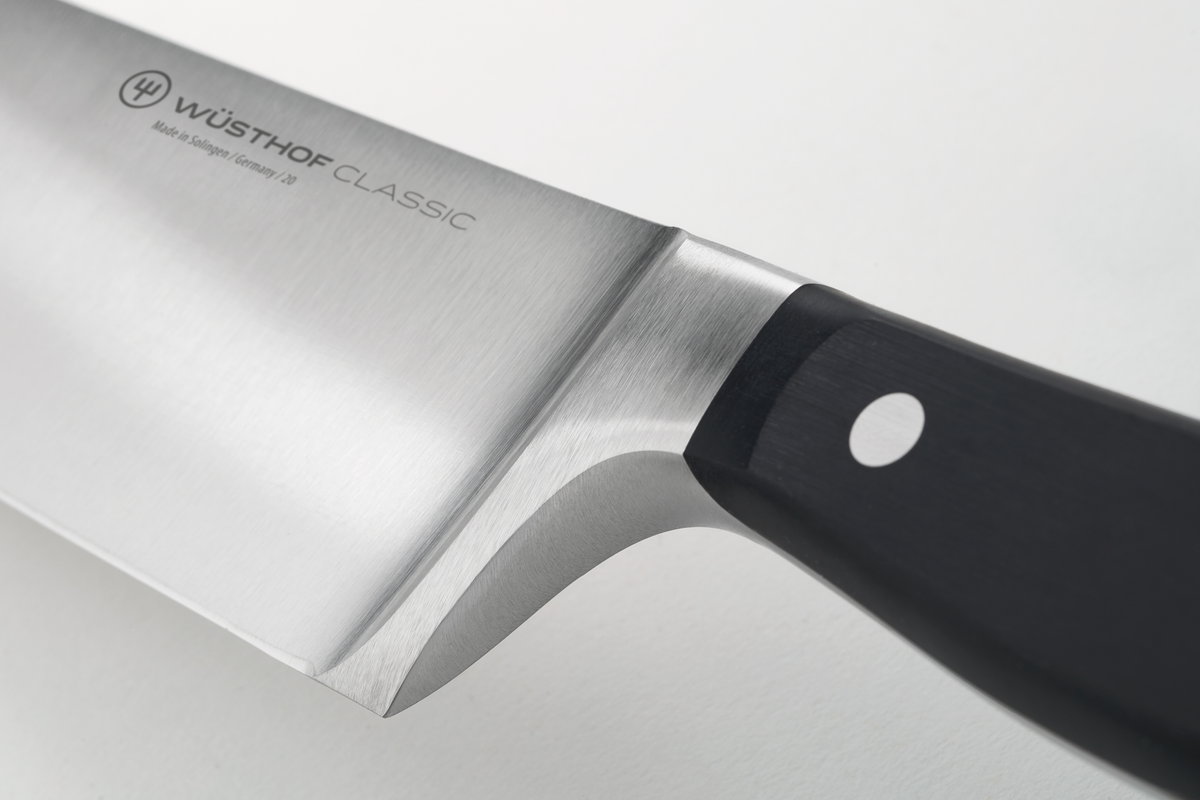 Classic 8" Chef's Knife showcasing a polished German forged blade with a full bolster and a black handle secured by a single rivet for precision and durability.