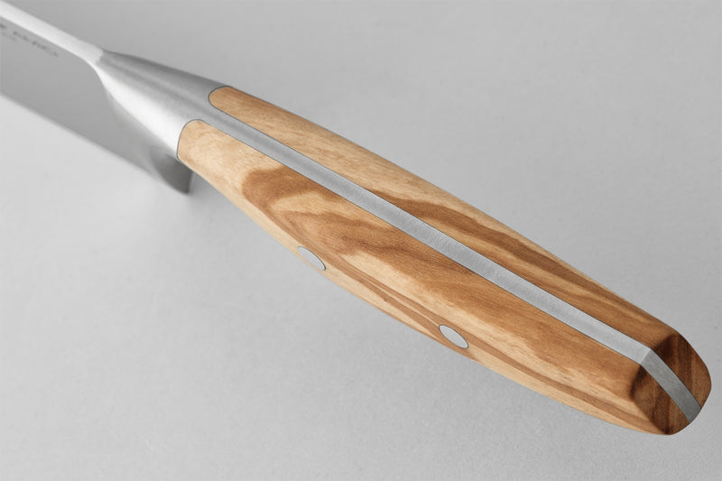 Close-up of the smooth olive wood handle with a seamless stainless steel tang and metal rivets on the "Amici 9" Precision Double-Serrated Bread Knife.