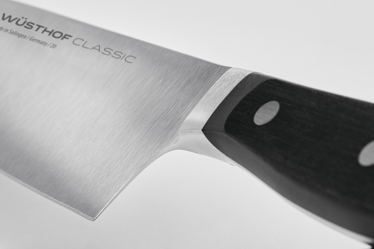 Classic 6" Half Bolster Chef's Knife with a forged German stainless steel blade and a black triple-riveted handle for durable, precise kitchen cutting.