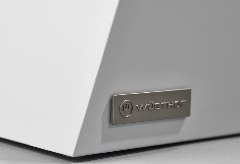 Close-up of the WÜSTHOF logo plaque on the white body of the Classic Slim Knife Block, highlighting its clean modern design.