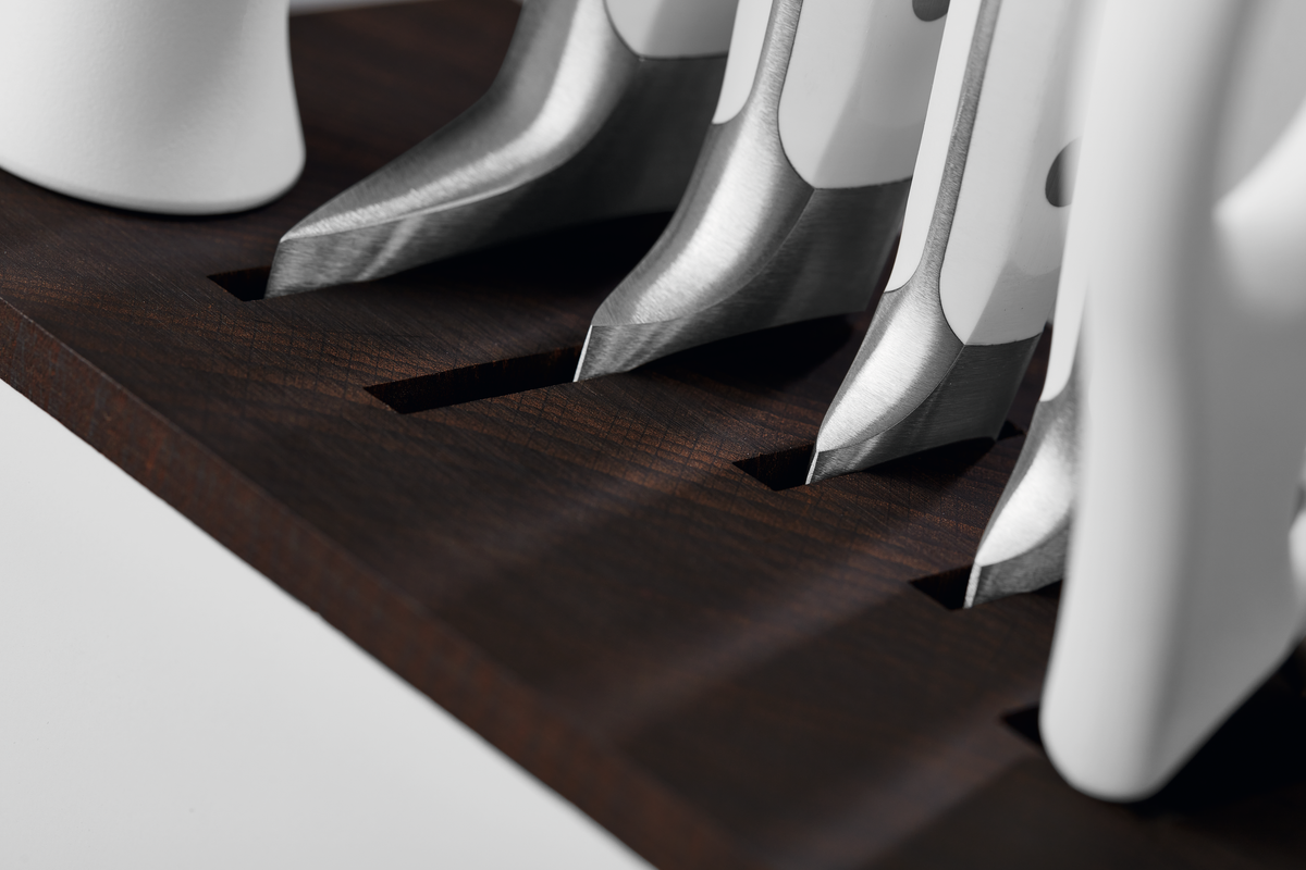 Classic 7-Piece Knife Block Set with Bread Knife showing sharp forged stainless steel blades with white ergonomic handles resting in a dark wood knife block.