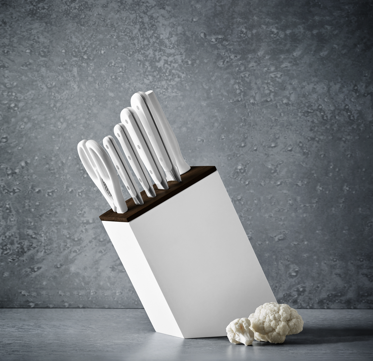 Classic 7-Piece Knife Block Set with Bread Knife featuring ergonomic white handles, sharp forged German stainless steel blades, and a sleek white block with a dark wood top.