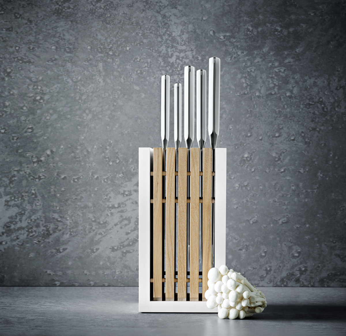 Classic Designer Knife Block with vertical natural wood slats and white outer frame, holding stainless steel knives with polished handles.