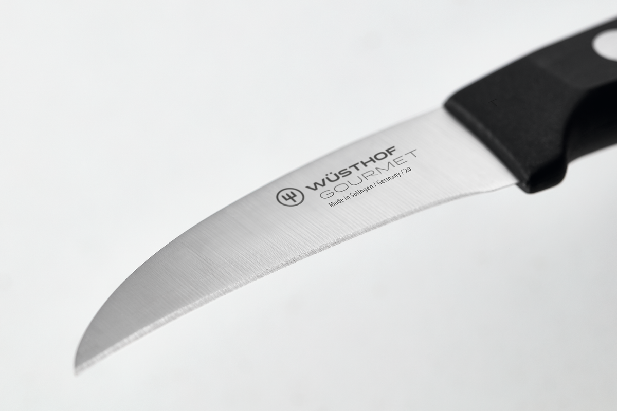 Gourmet 2 1/4" Peeling Knife with a curved, finely sharpened stainless steel blade and a black ergonomic handle designed for precision peeling tasks.