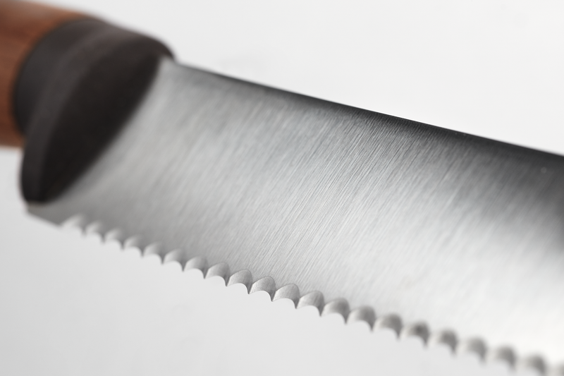 Urban Farmer 9" Bread Knife featuring a serrated stainless steel blade with fine teeth and a polished wooden handle, crafted for precision slicing.
